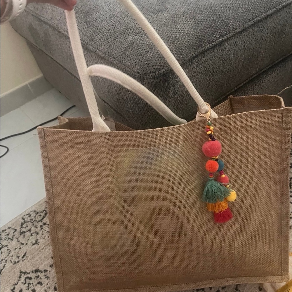 Stylish Tan Tote Bag with Colorful Tassel